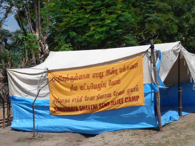 there is a tent with signs for the camp
