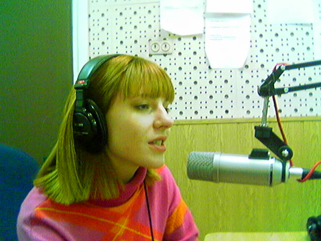 a young woman in a headphone recording
