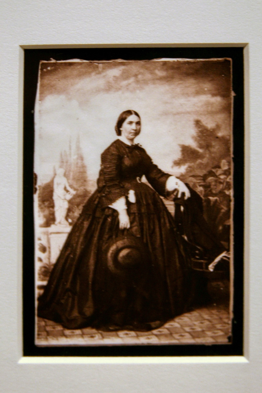 an old fashioned portrait of a woman in black