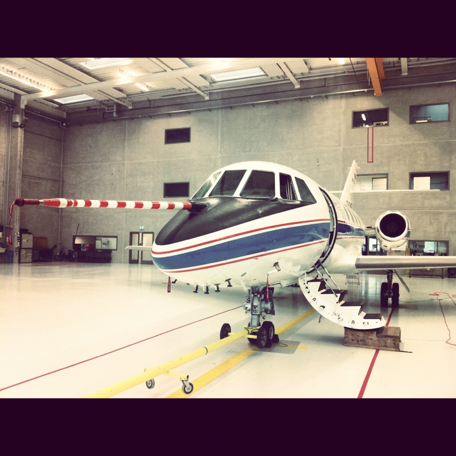 a small passenger jet parked in a building