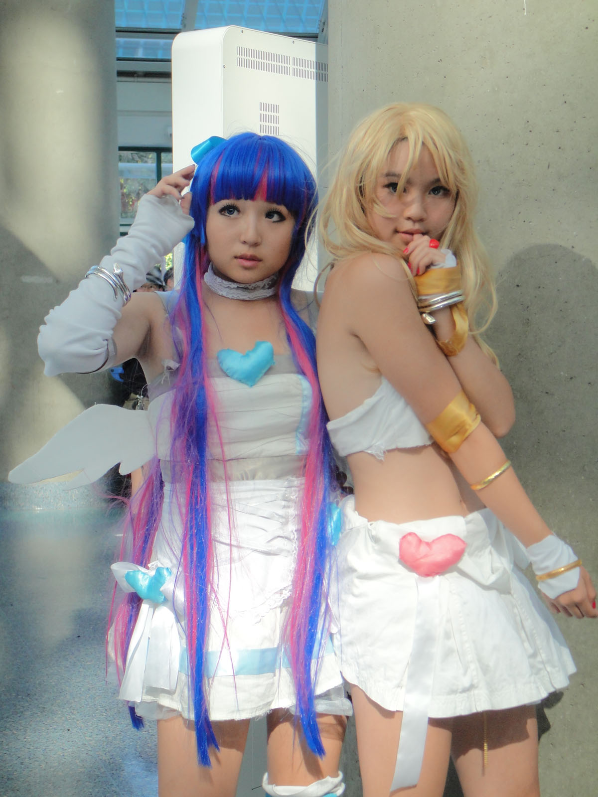 two girls dressed up as characters are posing