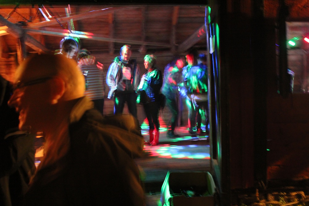 there are many people dancing on a large dance floor