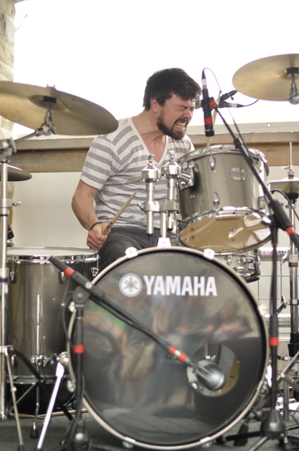 an image of drummer playing on the drums