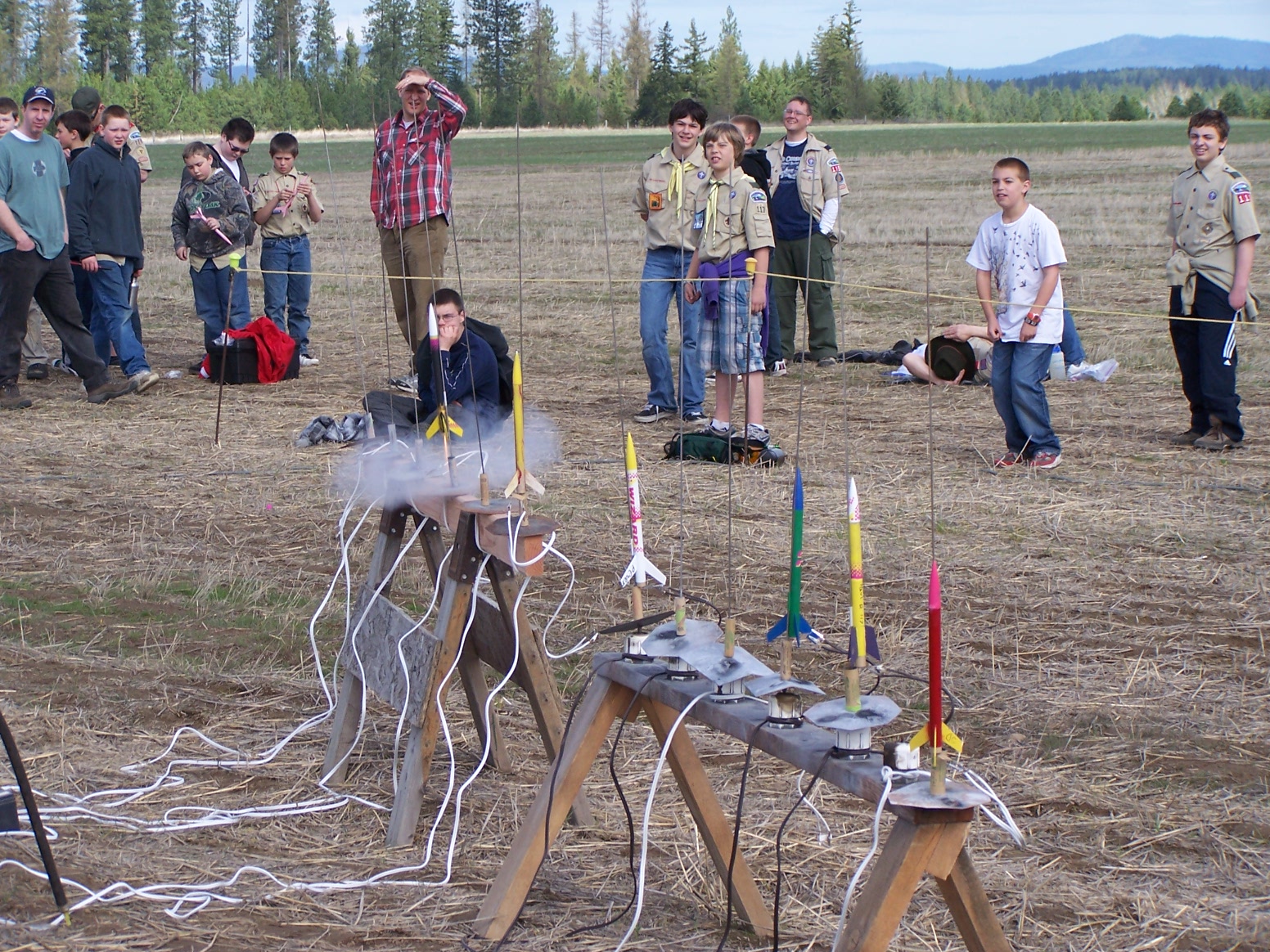 the men are preparing to put on small objects