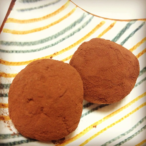 two brown round treats on a plate