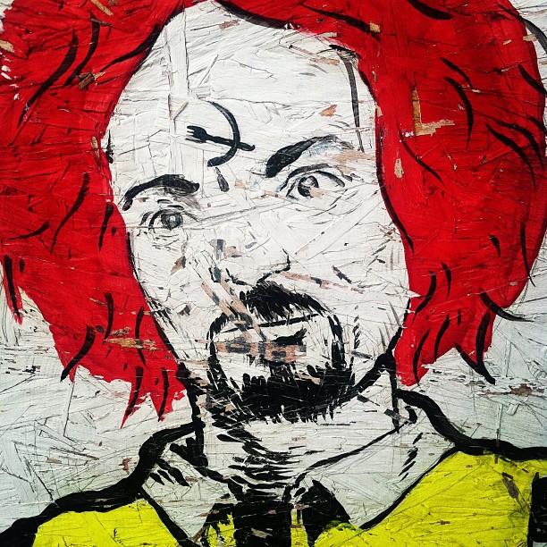 the painting shows a bearded man with red hair