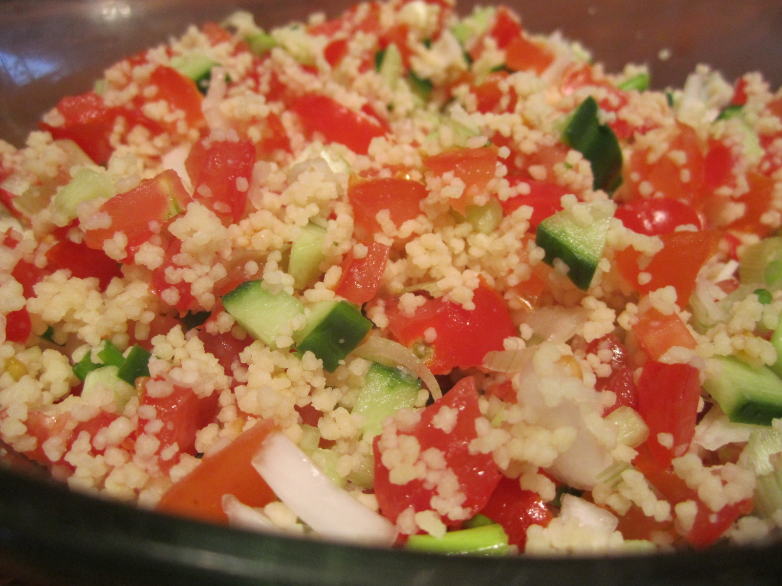 a bowl filled with rice and vegetables mixed together