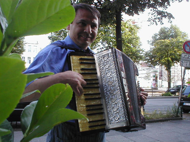 an image of a man that is playing the accordion