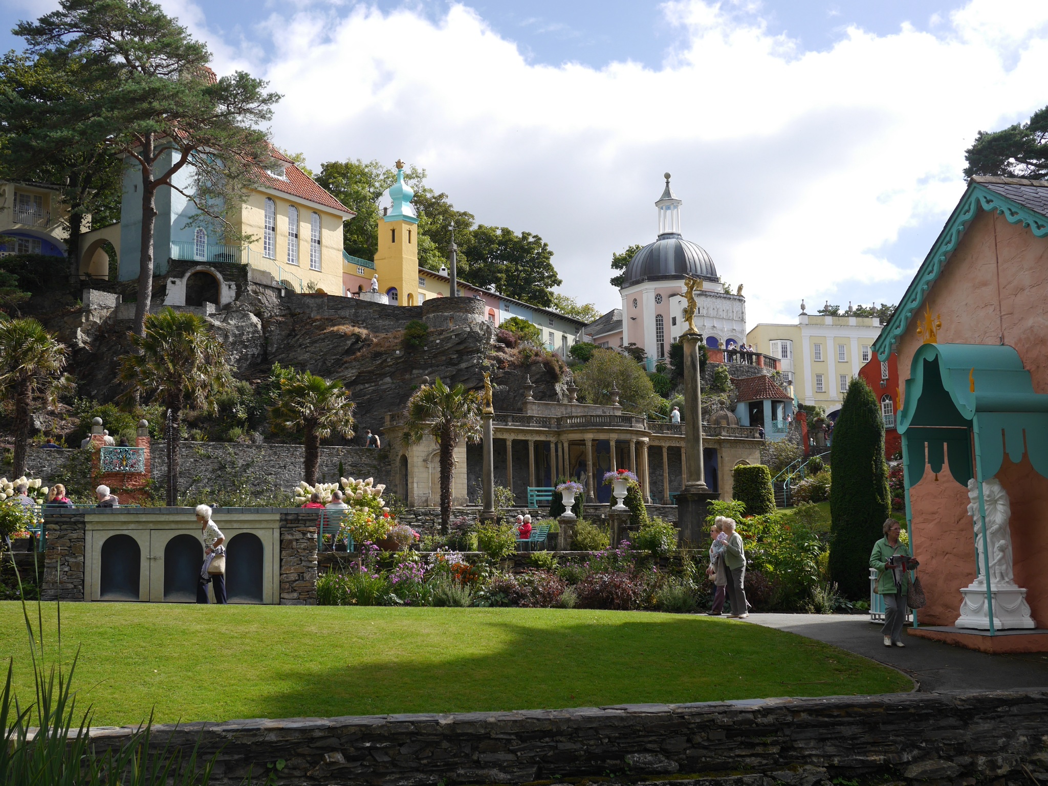 a garden with many trees and houses on it