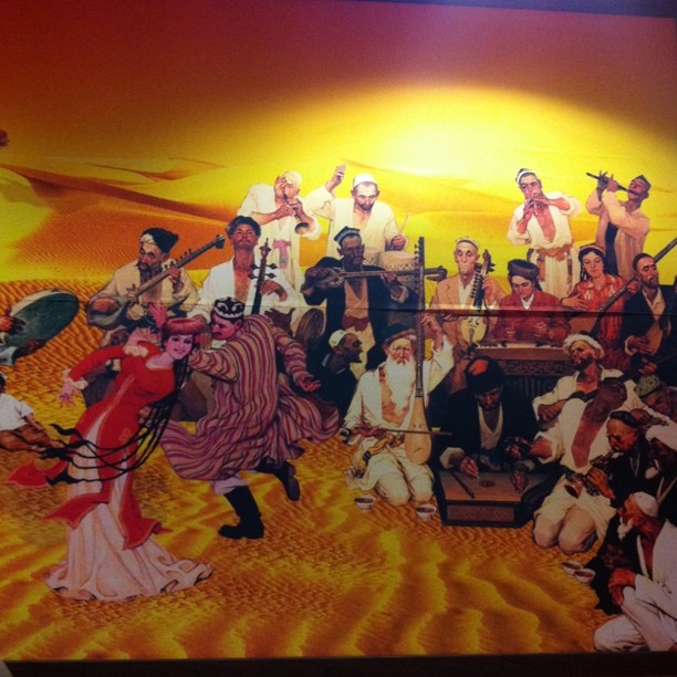 large group painting depicting oriental folk and traditional music