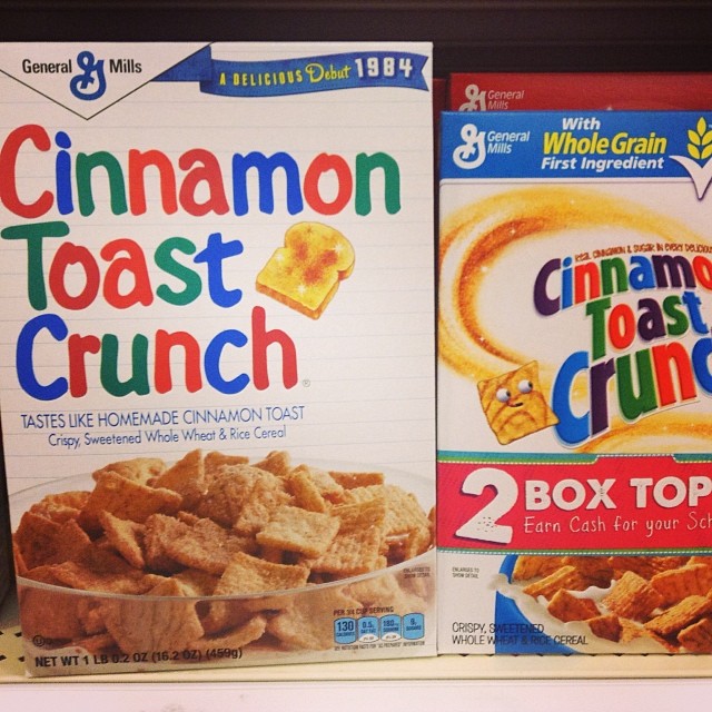a shelf with two boxes of cinnamon toast crunch and a box of cinnamon toast crunch