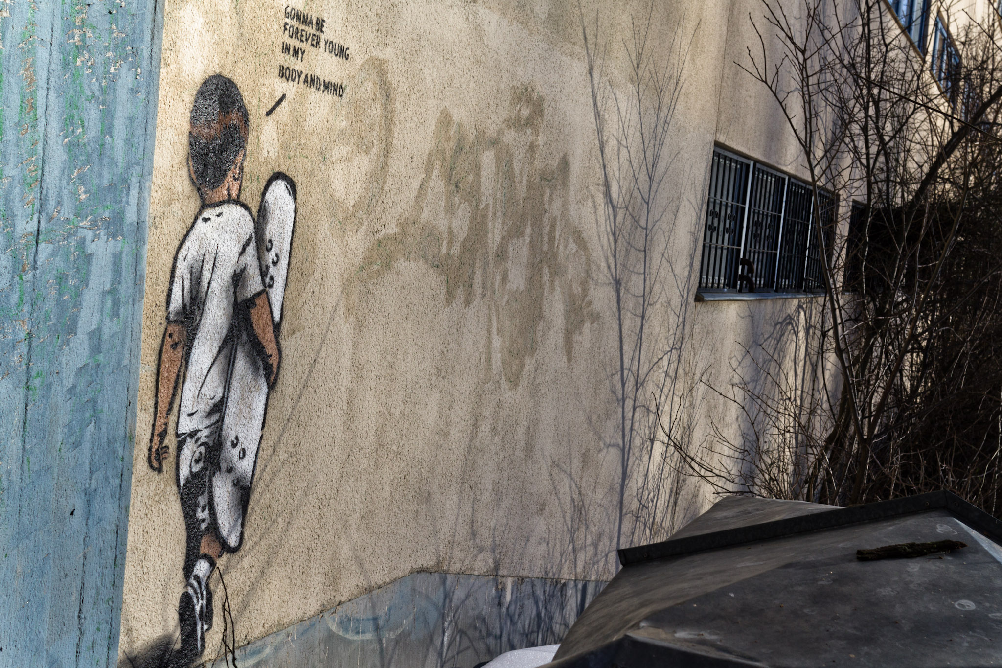 a mural on the side of a building with a picture of a person