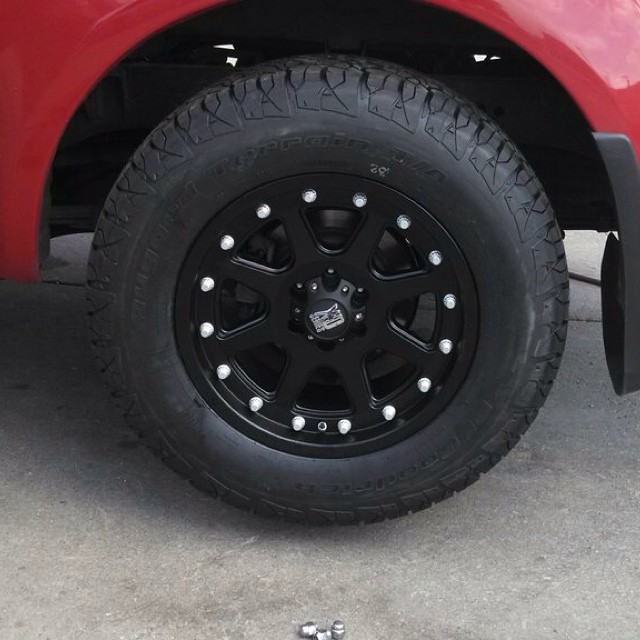 a red truck is shown with black wheels