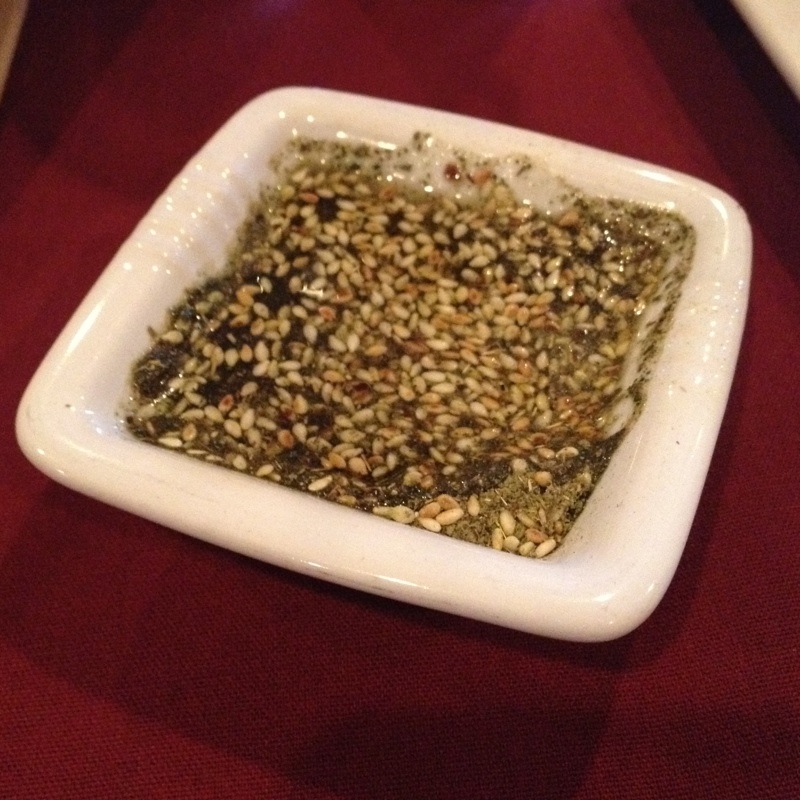 a rectangular white dish with a mixture of bird seed