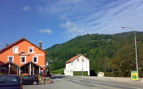 two orange buildings with red roof next to each other