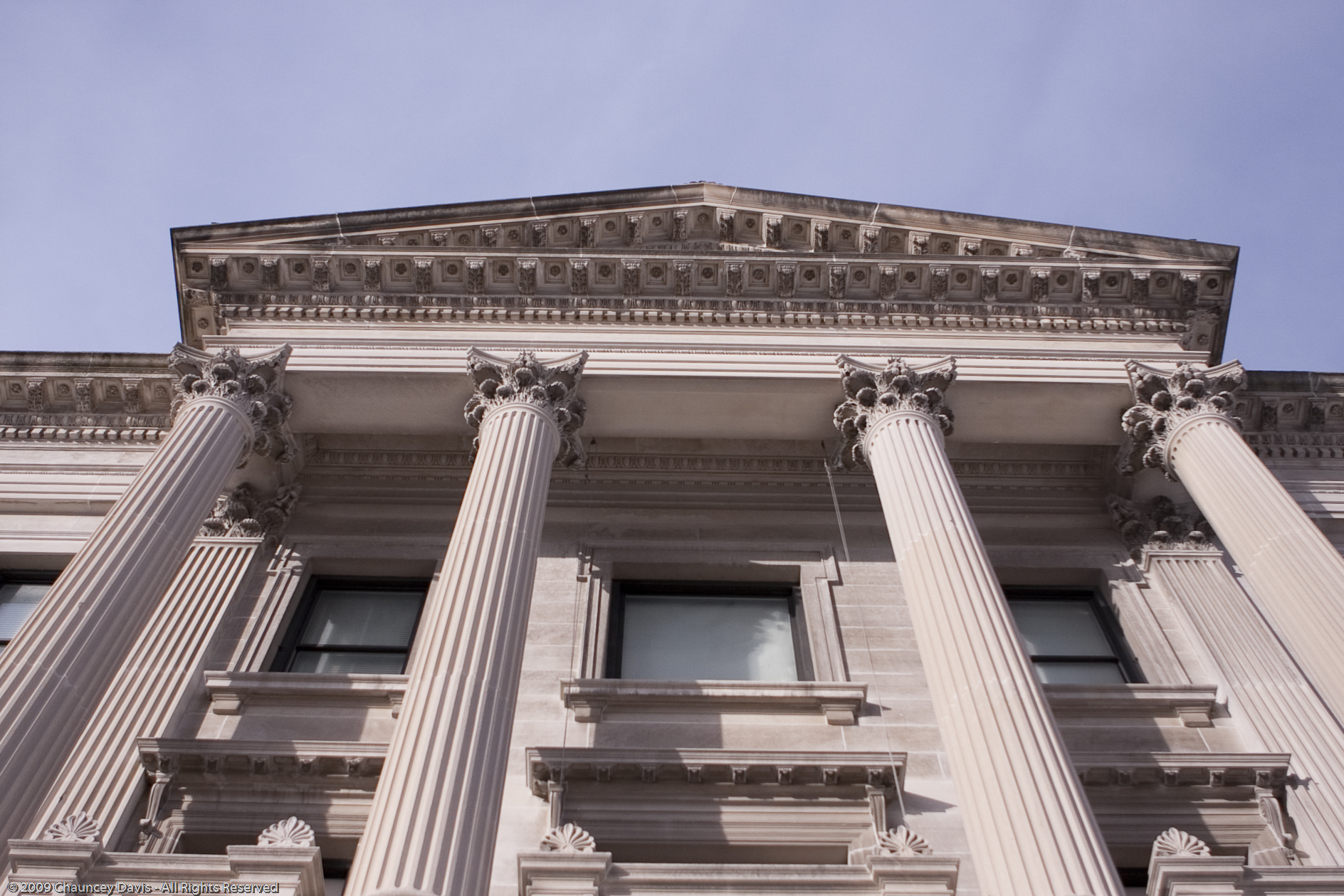 tall white pillars on the front of a building