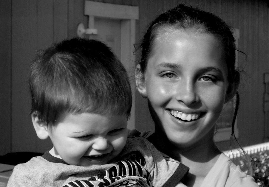 woman with her son in black and white po