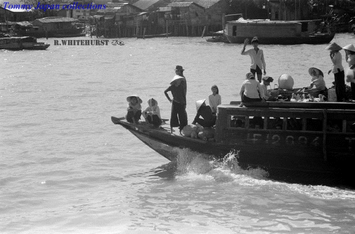 several people are in a motorboat with two men and two children