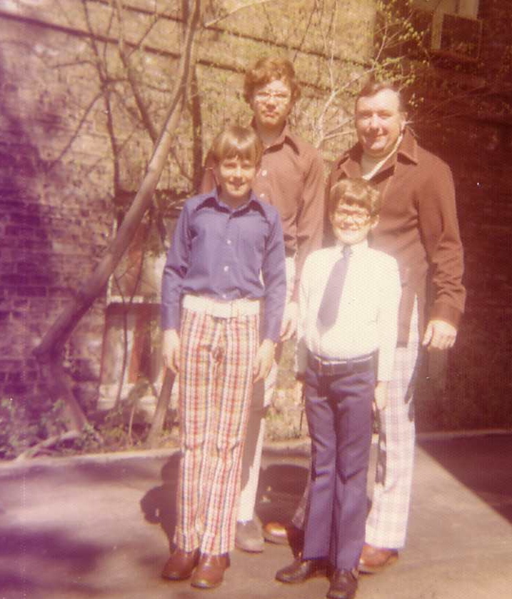 a group of people are standing on a street