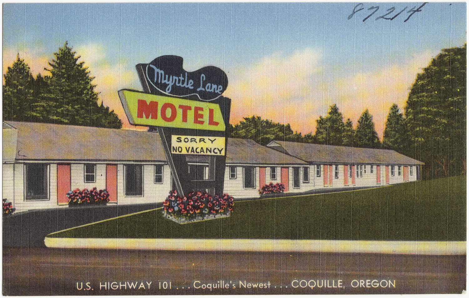 vintage motel on the corner of a street
