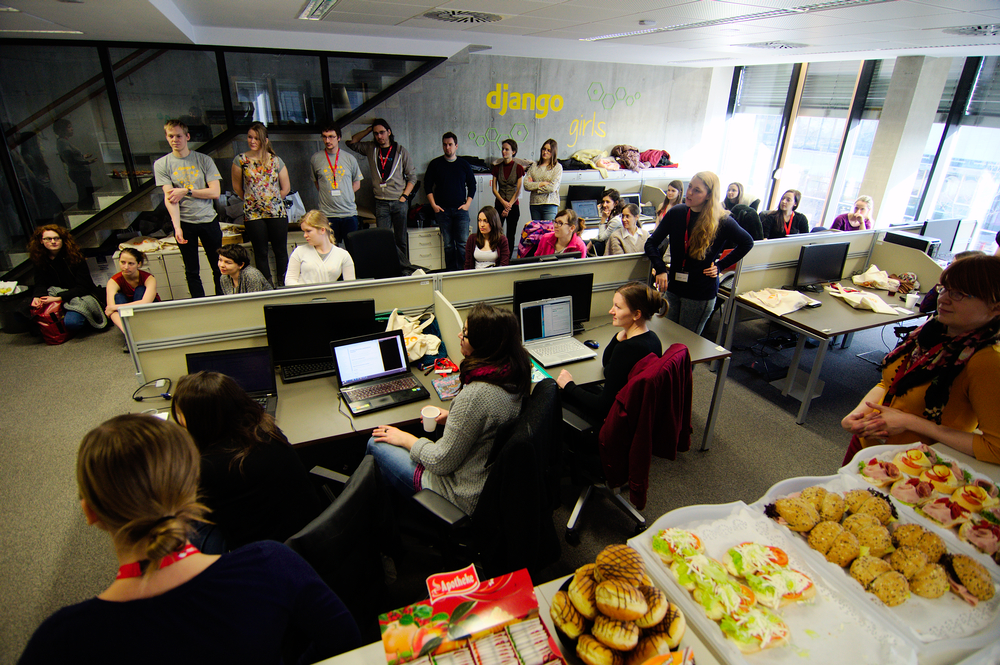 a bunch of people are on the computer desk in an office