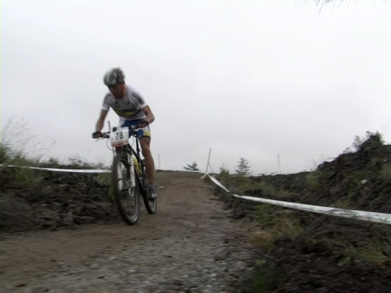 a man rides his bike on a rocky trail