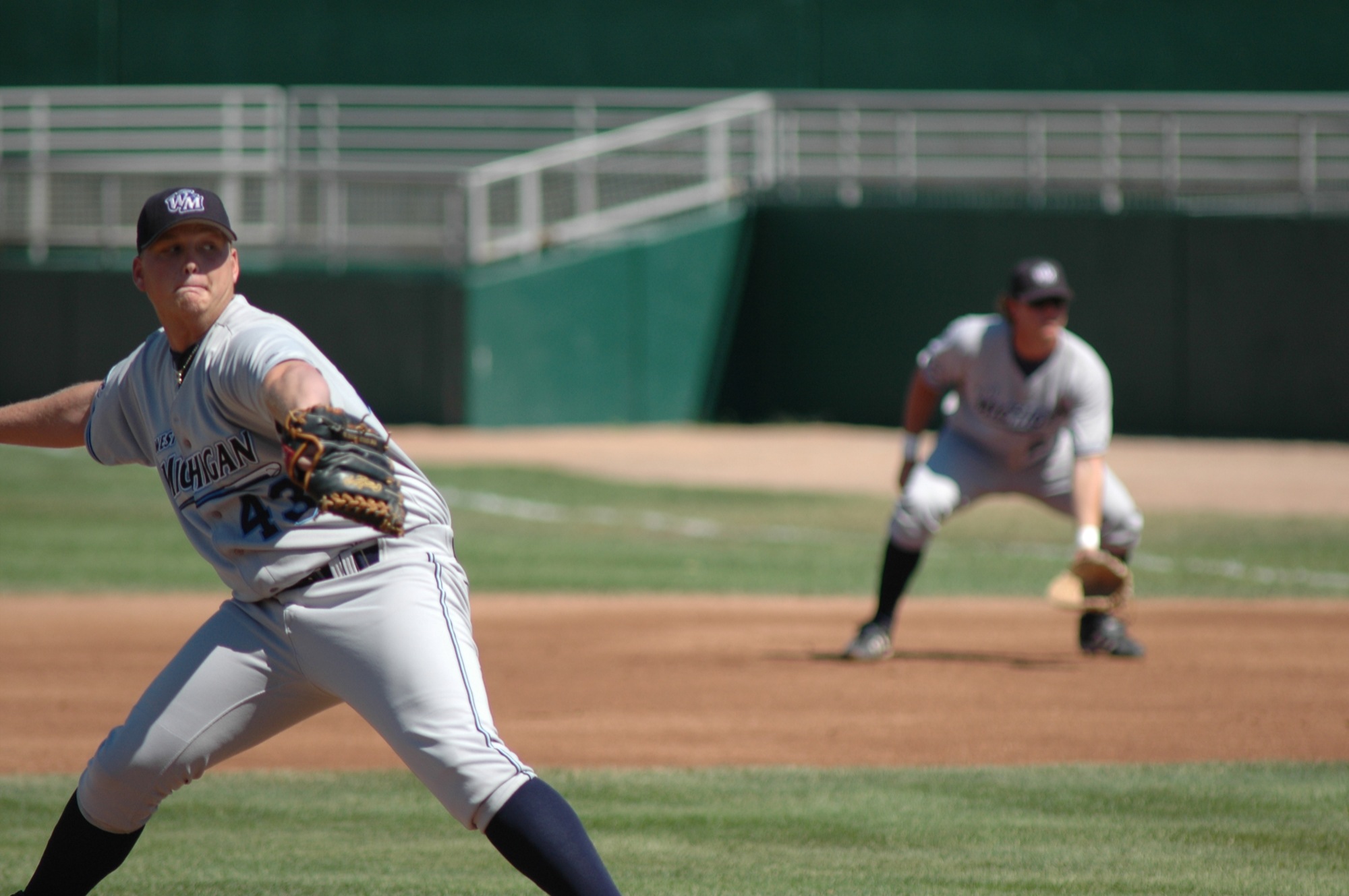 the base ball player is on his way to the next pitch