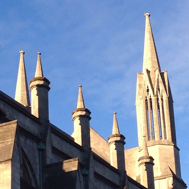 an image of tall buildings with steeple tops