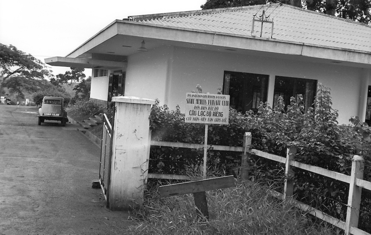 a house with a picket fence and sign