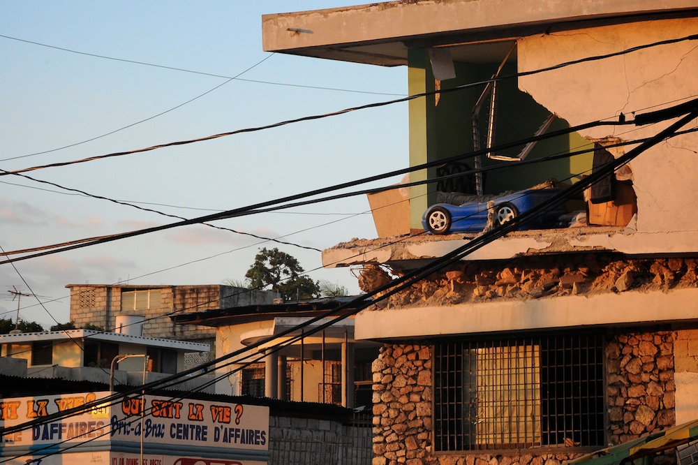 there is a small car parked at the top of a building