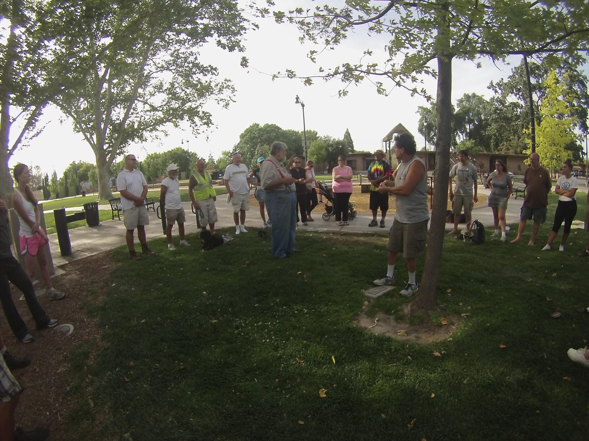 a bunch of people are standing in the park