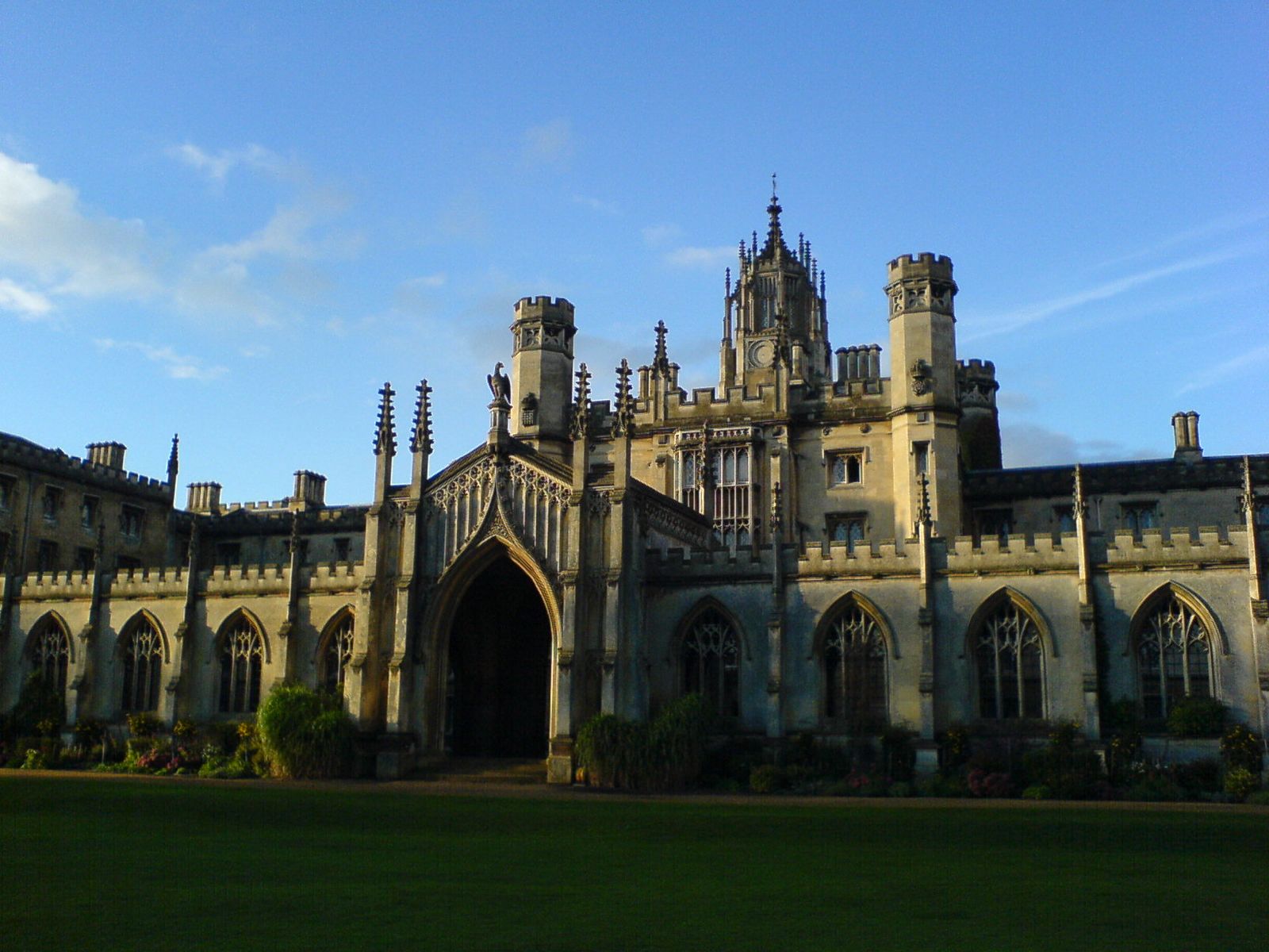 an old, castle - like building is shown in front of blue sky