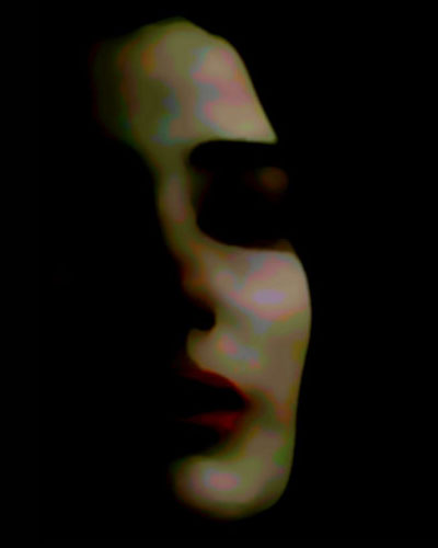a blurry po of a person's face with eyeliner