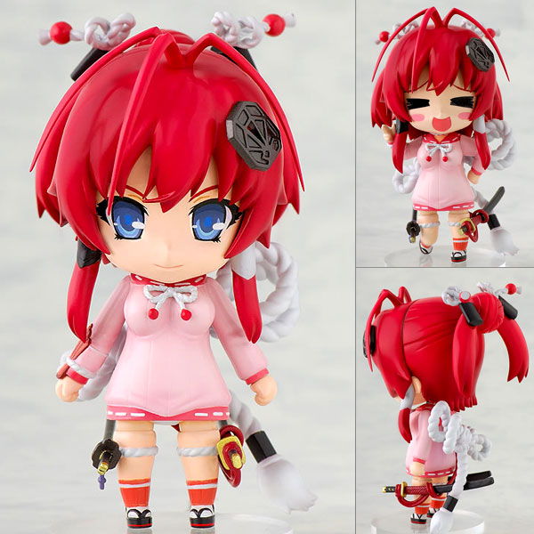 a figurine of a girl wearing pink and red hair