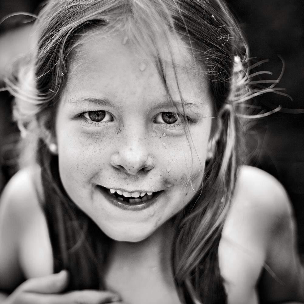 black and white po of a little girl smiling