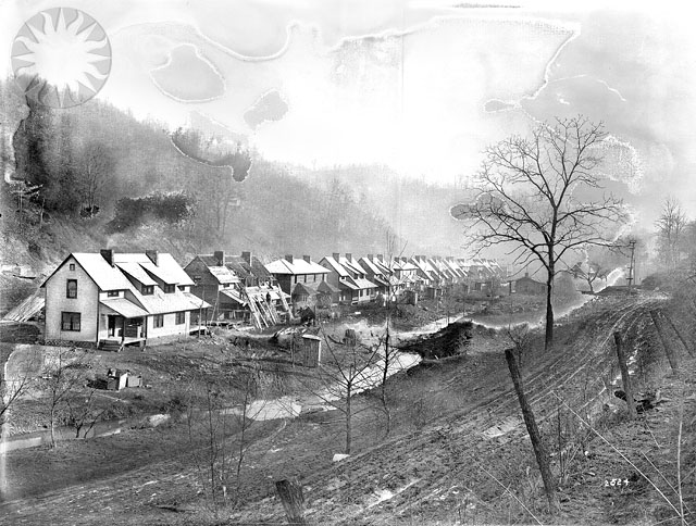 an old black and white picture of a village