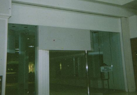 the entrance to a very large building at night