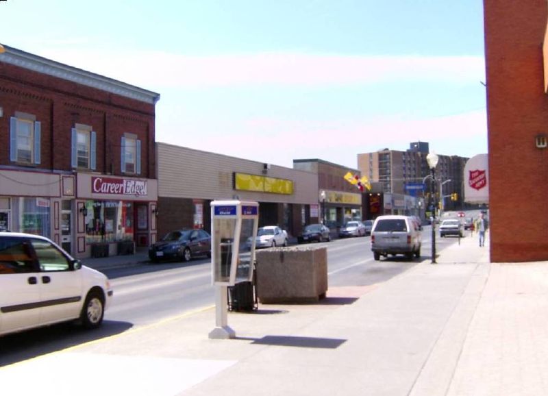 cars are parked along the side of the street