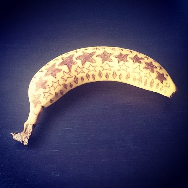 a small banana with stars on it sitting on a table