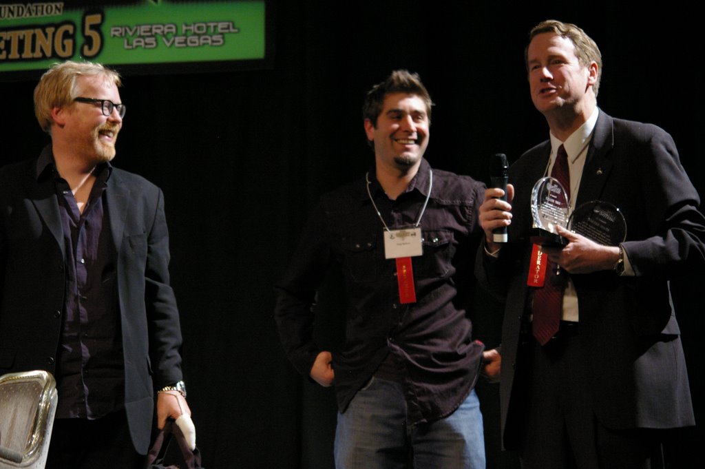 a group of men standing next to each other on a stage