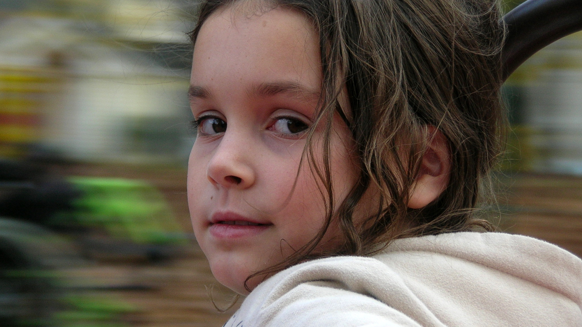 a young child stares out at the camera
