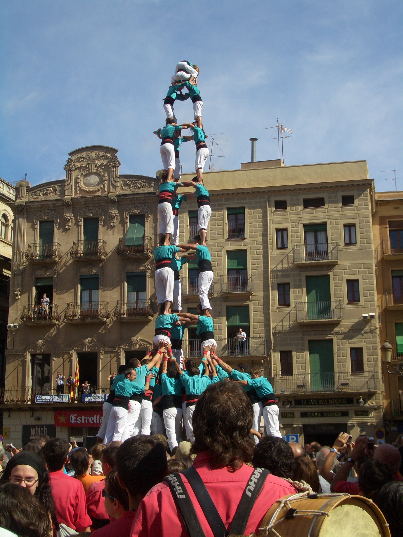 a group of dancers are doing a show for the crowd