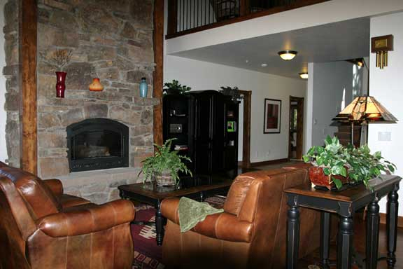 a living room filled with furniture and a fire place