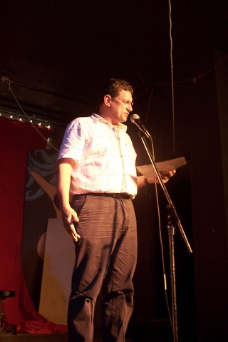 the man is speaking in a microphone at the event