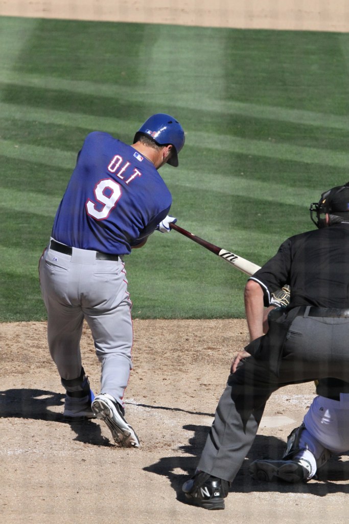 a baseball player is swinging a bat during the game