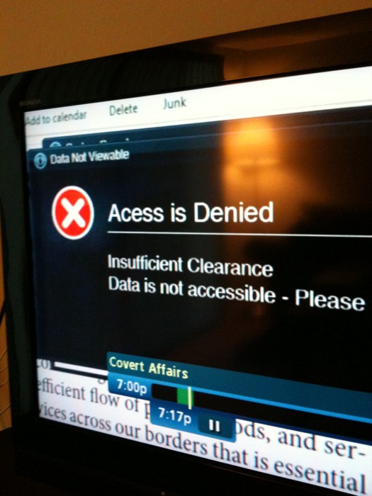 a television screen shows a warning about access is being closed