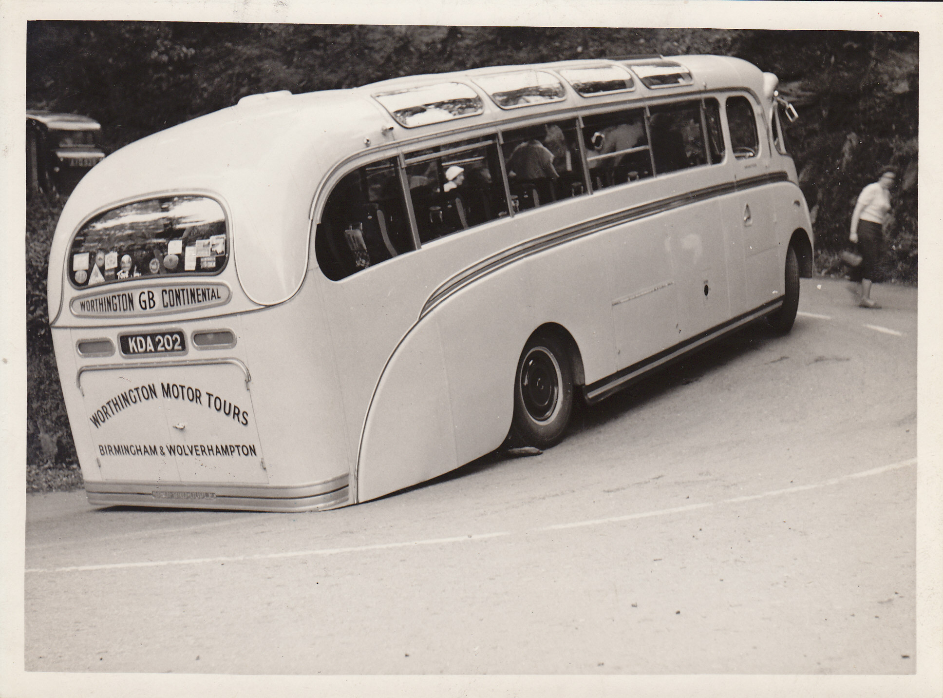 this is an old bus with windows parked in the driveway