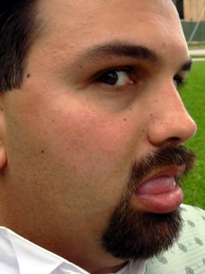 a man with a large tongue sticking out