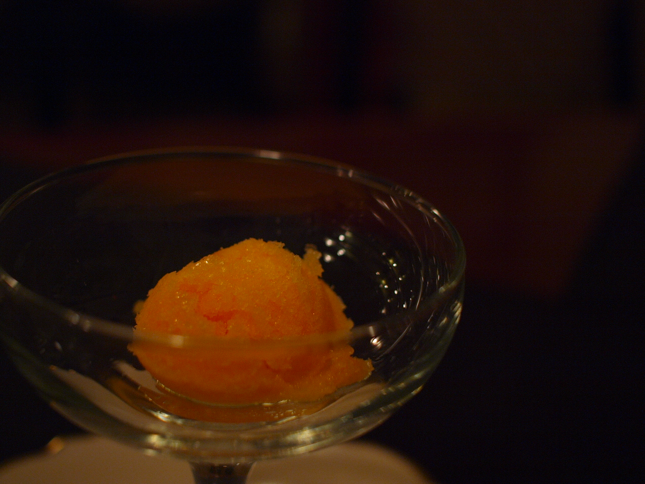 a desert with orange on top of a napkin