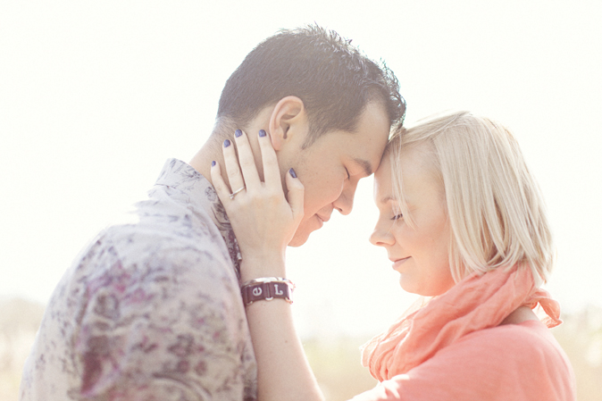 a man and woman are touching hands together